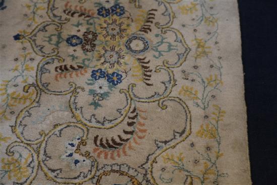 A Kashan cream ground five colour carpet, 15ft by 10ft 8in.